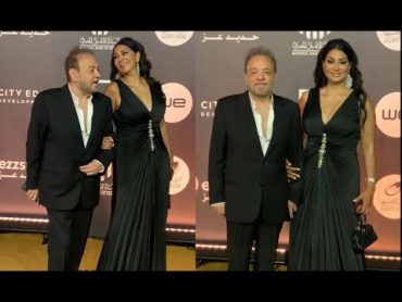 وفاء عامر ترتدي فستان مكشوف الصدر ومجسم وتصطحب زوجها معها فى مهرجان الدراما